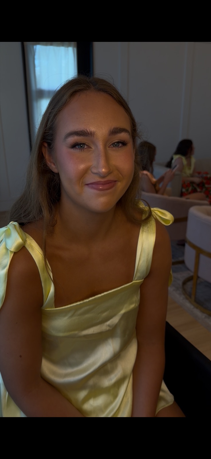 Bride in robe with finished makeup